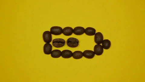 Charging the battery with coffee. Close up. Stop motion Stock Footage 124422418