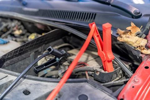 Charging the car battery using electric cables Stock Photos