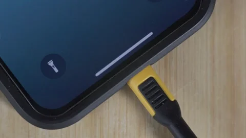 Charging a cell phone - plug and unplug Stock Footage 250410696