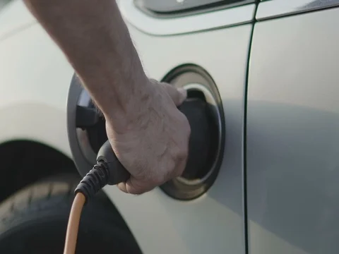 Charging of electric car Stock Footage 79924595