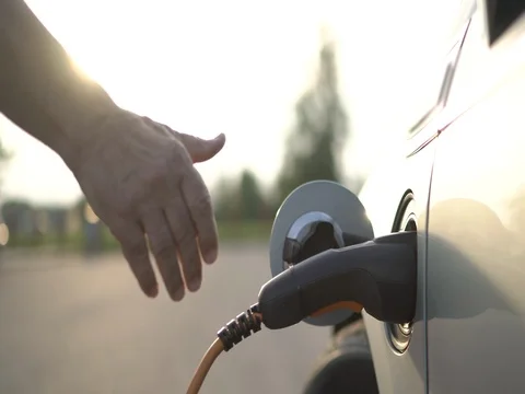 Charging of electric car Stock Footage 79924729