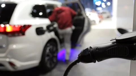 Charging of an electric car Stock Footage 87831011