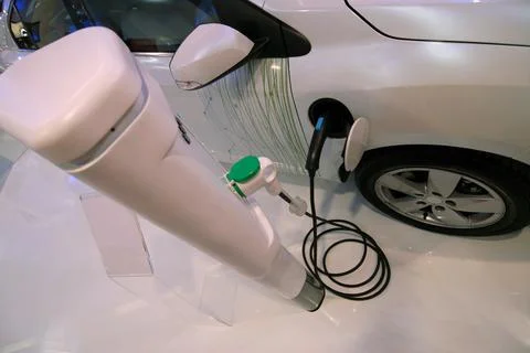 Charging electric car Фото