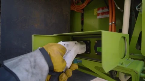 Charging an electric vehicle mining dump truck showcasing sustainable mining Видео 331791374