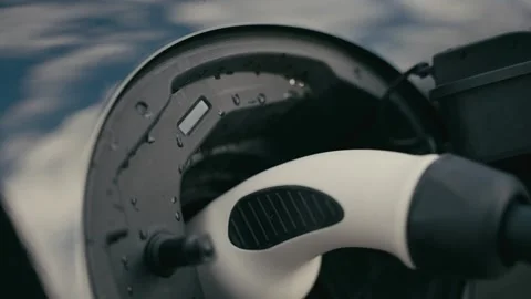 Charging Electrical Car Plug Connected to a Modern Vehicle Power Port Vidéo 331164360
