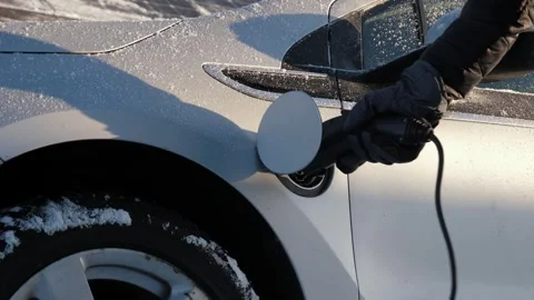 Charging EV in winter Stock Footage 303385127