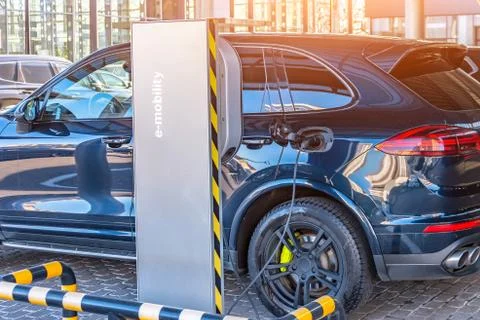 Charging the machine, compartment door is open, the electric plug under volta Stock-Fotos