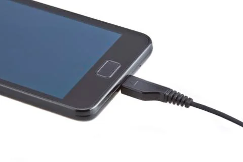 Charging of mobile phone Stock Photos