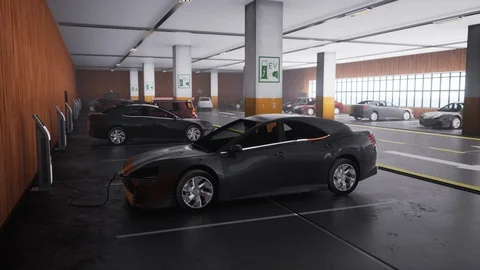 Charging of modern electric car in the parking lot. Stock Footage