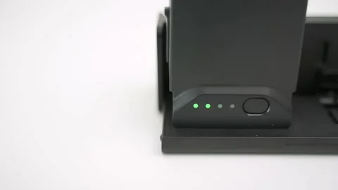 Charging modern quadcopter drone battery Video stock 146831617