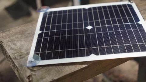 Charging phone with a portable solar panel. Video stock 241738883