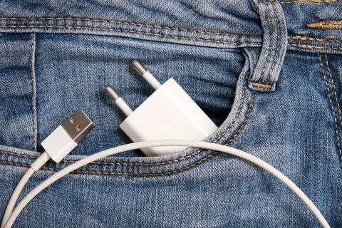 Charging smartphone concept, a usb cable with adapter plug for charging devices Stock Photos