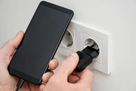 Charging of a smartphone. Stock Photos