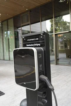 Charging station with a charging cable attached Stock Photos
