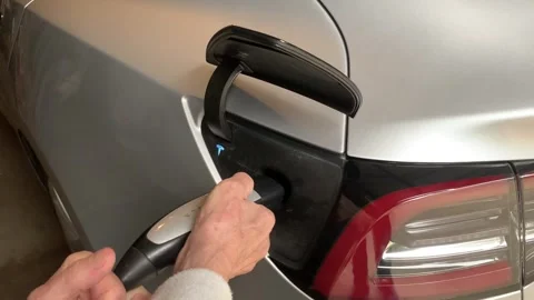 Charging Tesla Model 3 auto drive consumer safety recall Stock Footage 259845676