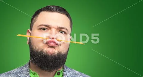 Charismatic bearded man with pasta Stock Photos