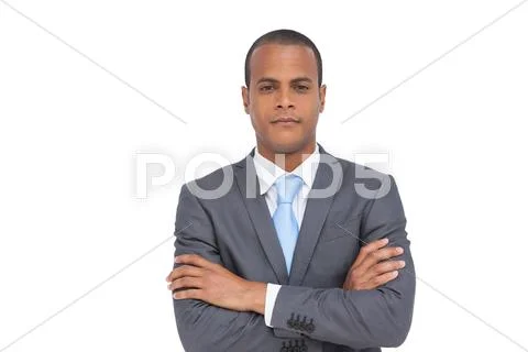 Charismatic businessman with arms crossed Stock Photos
