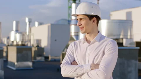 Charismatic businessman posing in front of the camera on the top of construction Stock Footage 150393265