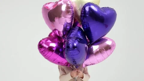 A charismatic child will dance with balloons Stockbeeldmateriaal 264048963