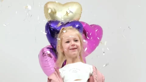 A charismatic child will dance with balloons Stockbeeldmateriaal 264049385