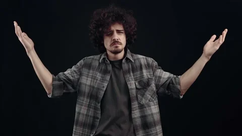 The charismatic, confused young man does not understand the question, says what Stock Footage 152732923