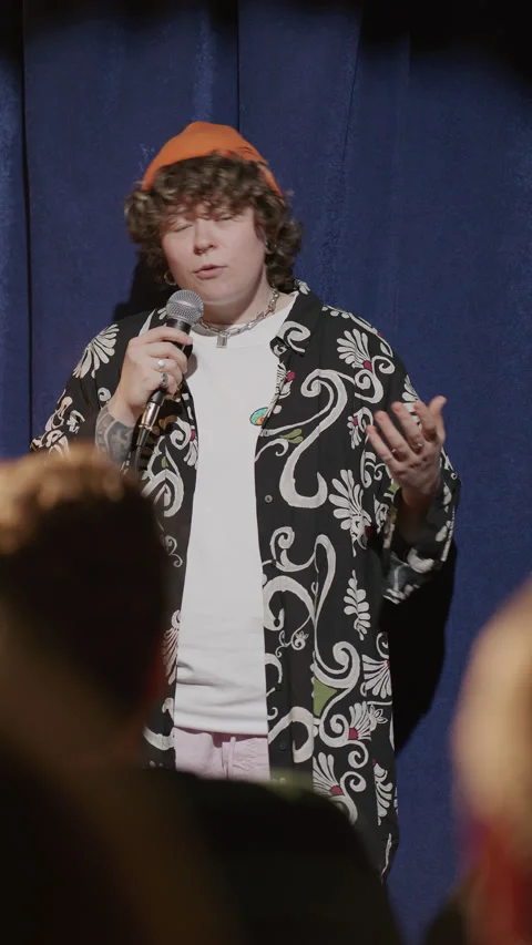 Charismatic Gen Z Comedian Performing Stand Up Set at Comedy Club Stock Footage 333228261