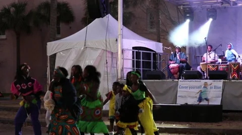 Charismatic group dancing to drums in front of band on stage Stock Footage 45565212