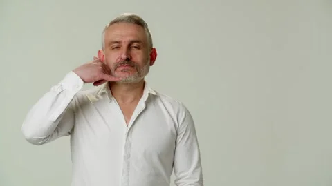A charismatic impressive middle aged man with playful emotions flirts and Stock Footage 252880196
