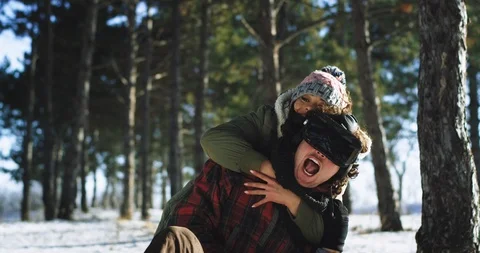 Charismatic lady and guy have a fun time together while sitting on the sleigh in Stock Footage 111969147
