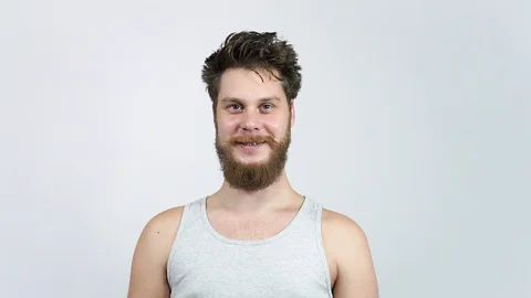 A charismatic man laughs happily at the camera. Close-up of a happy man Stock Footage 122442309