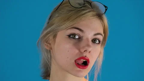Charismatic model opens mouth running tongue over upper teeth 库存影片 287573189
