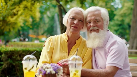 Charismatic old couple posing in front of the camera looking stray and smiling Video stock 164733059
