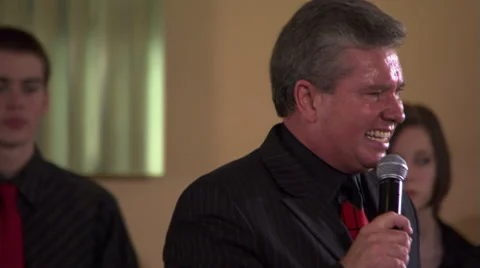 Charismatic preacher speaking to out-of-frame congregation Video stock 59537574