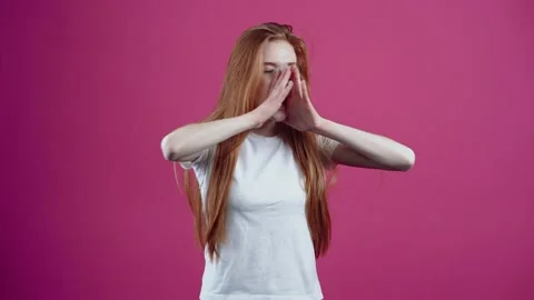The charismatic redhead puts her hands to her mouth and starts screaming in the Stock Footage 154770910