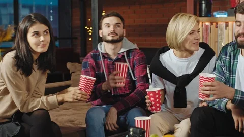 Charismatic smiling large multiethnic group of students have a little party they Stock Footage 122760338