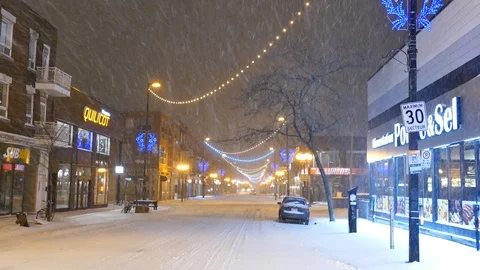 Charismatic street with lights during snowfall Stock Footage 125548334