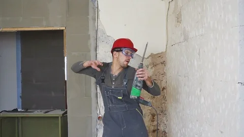 Charismatic young builder dancing with a security helmet on the rooftop of Video stock 100116185