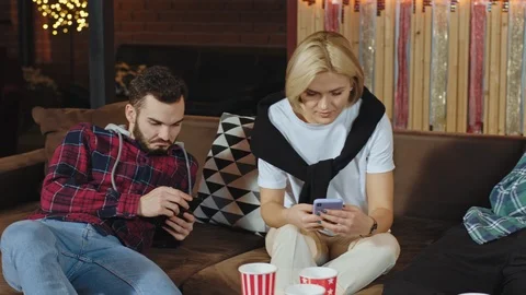 Charismatic young people on the sofa while have a break time in the office Stock Footage 124465283