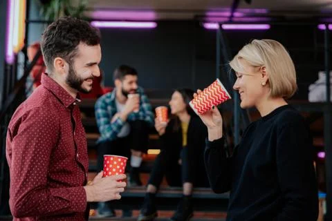 Charismatic young students while have a break time on the college drinking some Stock Photos
