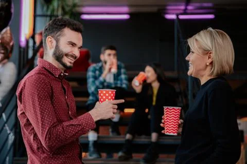 Charismatic young students while have a break time on the college drinking some Stock Photos