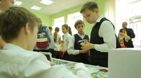 Charity fair, boy bought a disc with the movie Stock Footage 44362366