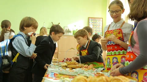 Charity fair, buyer eats Stock Footage 44359888