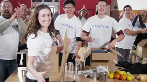 Charity worker holds up a
