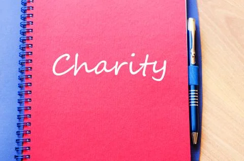 Charity write on notebook Stock Photos