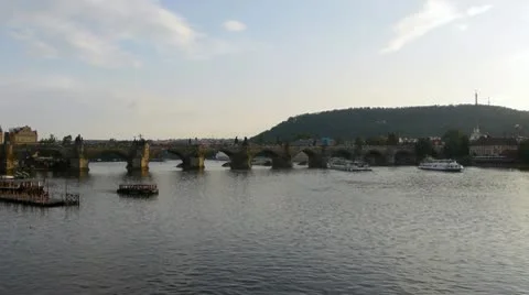 Charles Bridge and river with Petrin Hill in Prague, Czech Republic Stock Footage 10789979