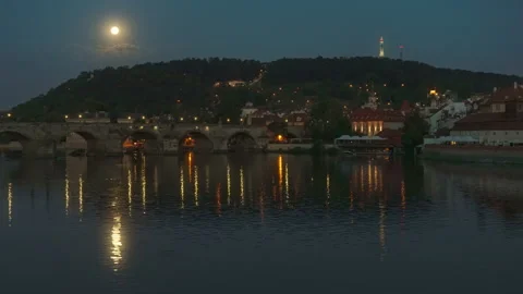Charles Bridge and Vltava River in Prague at night under a bright full moon 動画素材 341666773