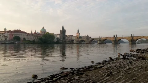 Charles bridge over the Vltava river at sunset Stock Footage 149074044