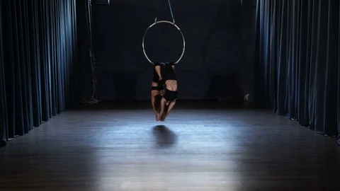 Charming acrobats performs a trick in th... | Stock Video | Pond5