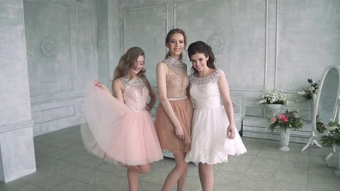 Charming and cute girls posing on camera. Girlfriends going to a party Stock Footage