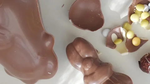 Charming Arrangement of Easter Chocolates and Colorful Eggshells Stock Footage 332944293